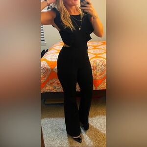 Black denim, flare leg, backless jumpsuit.